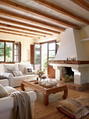 Mediterranean Comfort: Interior with Wooden Beams and White Fireplace