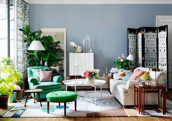 Elegant Eclecticism: Light-Filled Living Room with Green Accents and Layered Design