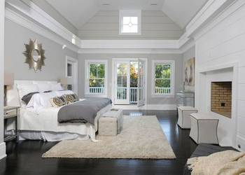 Elegant bedroom with high pitched ceiling and panoramic terrace access