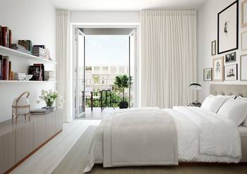 Light minimalist bedroom with French doors and integrated storage system