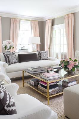 Elegant living room with pink-gray color scheme and classic architectural details