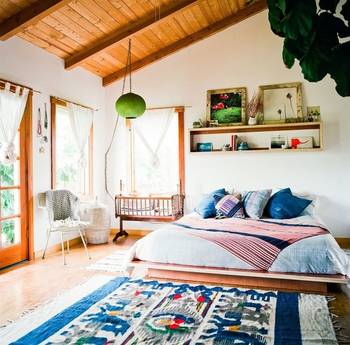 Organic Minimalism: Bright Country House Interior with Wooden Ceiling and Ethnic Accents