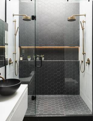 Modern bathroom with hexagonal tiles and gold fixtures