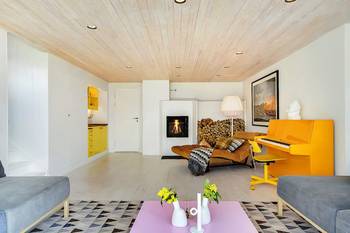 Scandinavian Minimalism with Bold Accents: Harmony of Wood and Color in Country House Interior