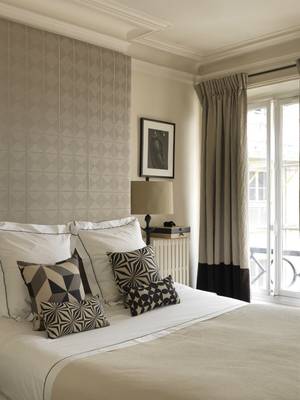 Elegant Bedroom with Geometric Accents in a Neutral Palette