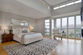 Bright modern bedroom with panoramic windows and elegant details