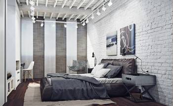 Photo of bedroom in country house in loft style.