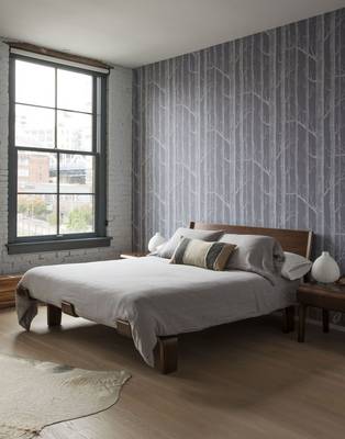 Modern bedroom with natural motifs: combination of wood and stylized tree wallpaper