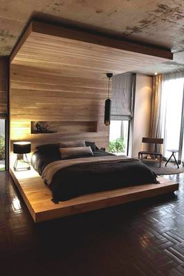 Beautiful design of bedroom in country house in loft style.