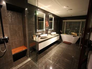 Elegant dark bathroom with contrasting white elements