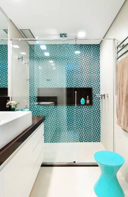 Modern bathroom with geometric turquoise accent