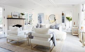 Bright minimalist living room with classic details and panoramic windows