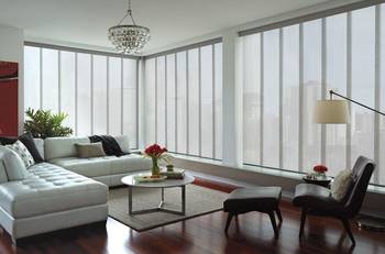 Modern urban living room with panoramic glazing and balanced light interior