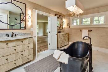 Elegant bathroom with vintage black bathtub in modern classic style