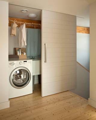Design of laundry in cottage in contemporary style.