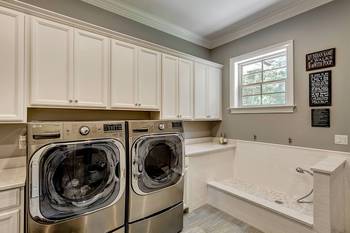 Interior of laundry in cottage in Craftsman style.