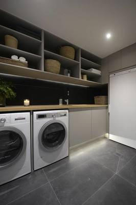 Laundry design in private house in contemporary style.