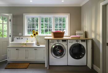 Interior design of laundry in private house in contemporary style.
