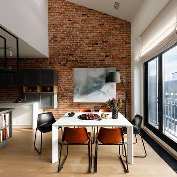 Dining room in house in loft style.
