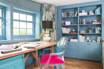 Beautiful design of home office in country house in fusion style.