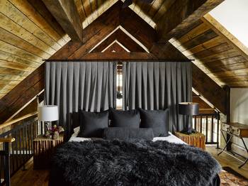Interior design of attic in private house in Chalet style.