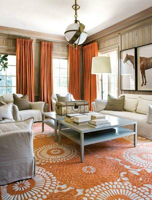 Warm Elegance: Living Room Interior with Orange Accents and Wooden Panels