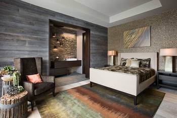 Elegant bedroom with textural contrast: wood, stone and modern comfort