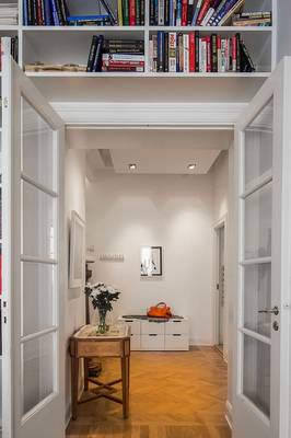 Elegant passageway with functional niches: harmony of classic and contemporary elements in interior design
