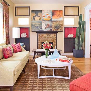 Modern living room with bright accents and artistic composition above the fireplace