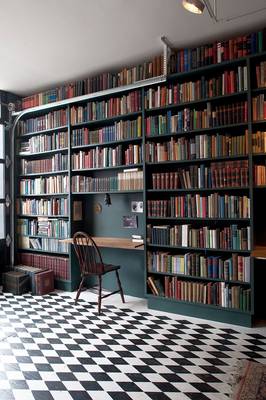 Beautiful design of library in private house in artistic style.