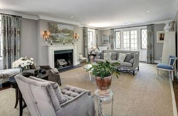 Elegant Gray Living Room with Classic Fireplace and French Windows