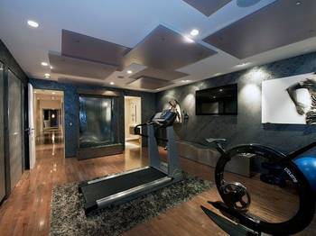 Interior design of gym in country house in artistic style.