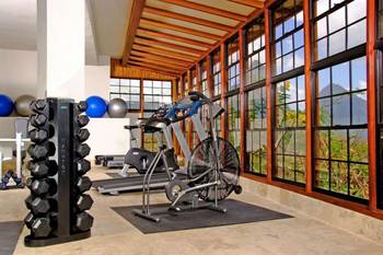 Beautiful design of gym in private house in artistic style.