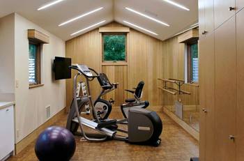 Beautiful design of gym in cottage in contemporary style.