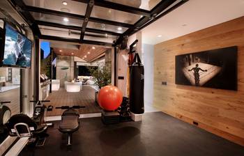 Photo of gym in private house in contemporary style.