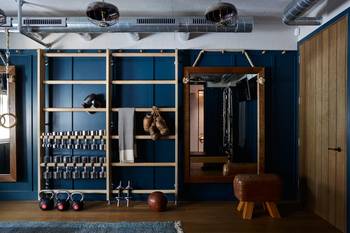 Interior design of gym in private house in loft style.