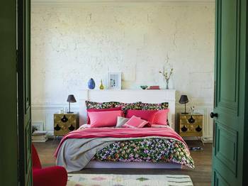Beautiful example of bedroom in house in fusion style.