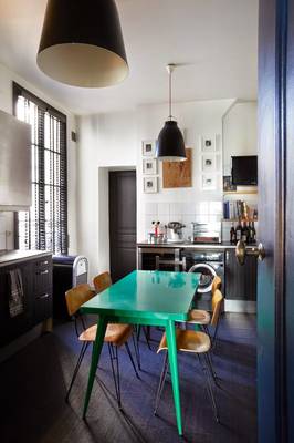 Photo of kitchen in country house in fusion style.