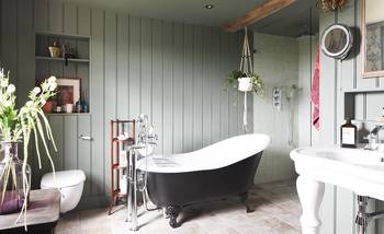 Beautiful design of bathroom in private house in Craftsman style.