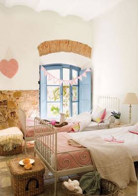Interior of bedroom in cottage in Mediterranean style.