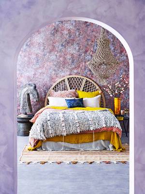Bedroom in private house in ethnic style.
