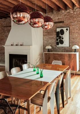Dining room design in private house in loft style.