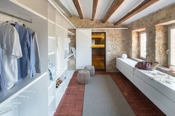 Wardrobe interior in private house in Mediterranean style.