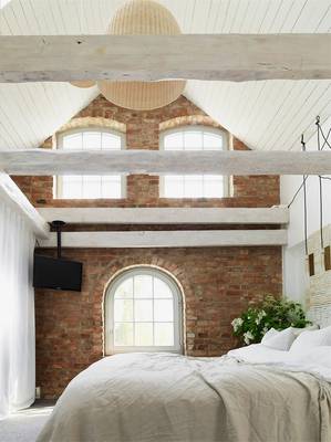 Bedroom interior in private house in loft style.