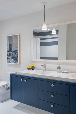 Elegant Bathroom in Marine Palette: Blue Furniture and Contrasting Accents