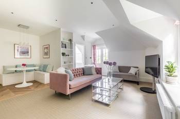 Refined Elegance of Attic Space: Contemporary Interior with Feminine Accents