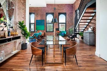 Interior design of dining room in country house in loft style.