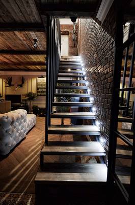 Design of stairs in country house in loft style.