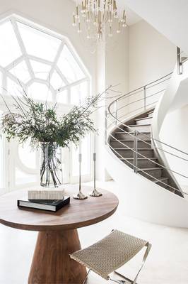 Light Symphony: Minimalist Vestibule with Spiral Staircase and Geometric Panoramic Window