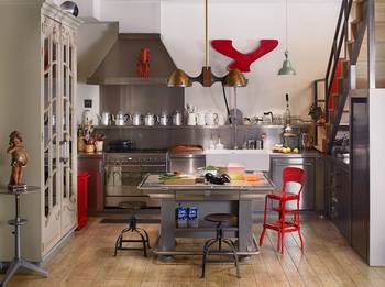 Interior design of kitchen in cottage in fusion style.